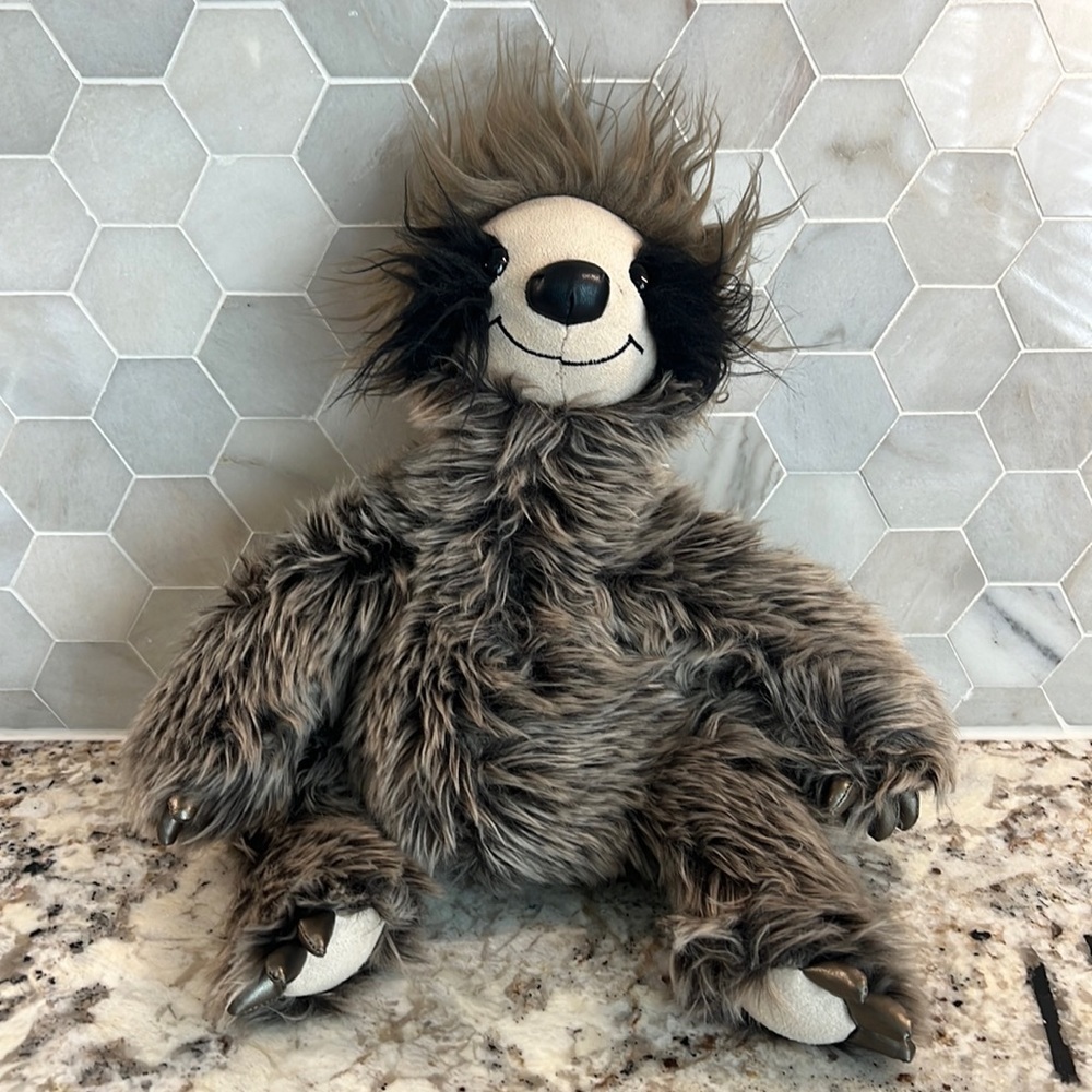 Guns Roswell the sloth stuffed animal